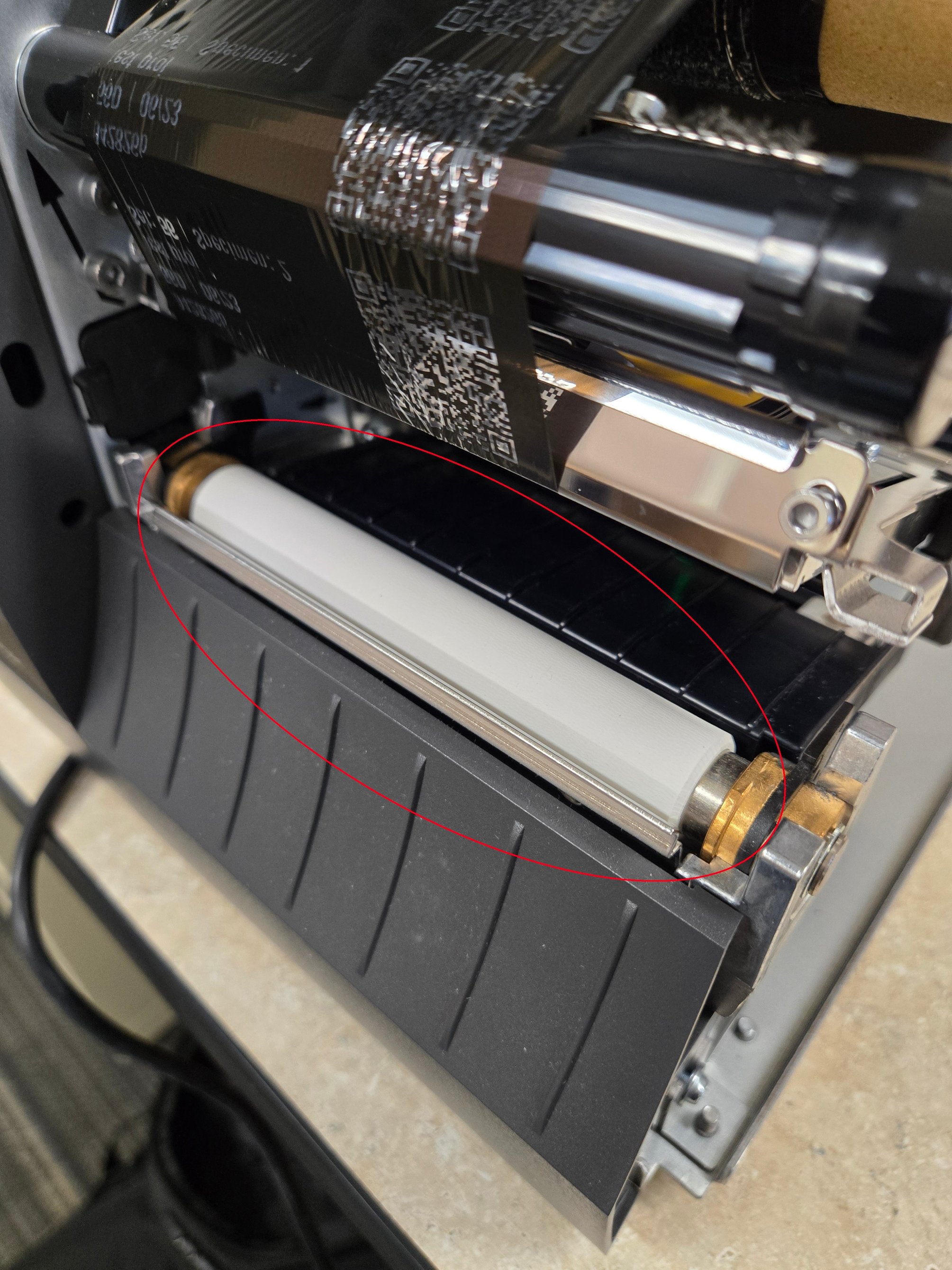 CLEANING THE ROLLER, MEDIA SENSOR, AND PRINT HEAD ON A ZEBRA ZT231